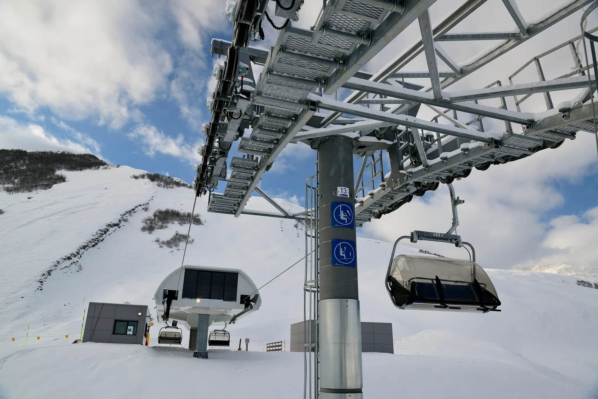 A chairlift above a snowy slope at Shahdag